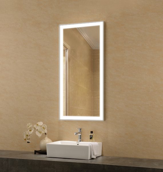 A bathroom with a large mirror above a sink.