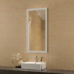 A bathroom with a sink and a mirror.
