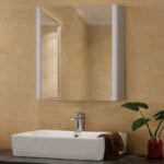 A bathroom sink with a mirror above it.